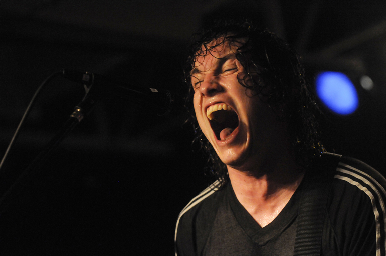 Against Me! frontman Tom Gabel yells into the microphone during his band's show at Rhino's All-Ages Club on Feb. 13, 2011, in Bloomington, Ind. (Alex Farris | Arbutus)