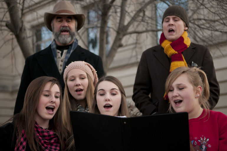 Carolers from The Biz Academy of Musical Theatre sing during Christmas on the Square in Danville, Friday, Nov. 29, 2013.