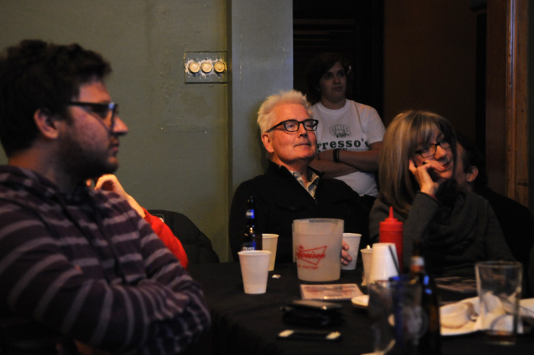 Local Obama campaign logistical team director Brian Cole, staging location director Jay Smith, and his wife Marianne watch results come in on Election Day at a bar in Columbus, Ohio.