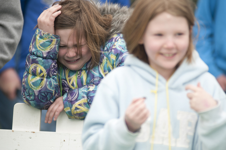 Shelby Allen reacts as Gracie Russell puts a cricket in her mouth during the cricket spitting competition at Purdue University\'s Bug Bowl on Saturday, April 13, 2013, on the Purdue campus.