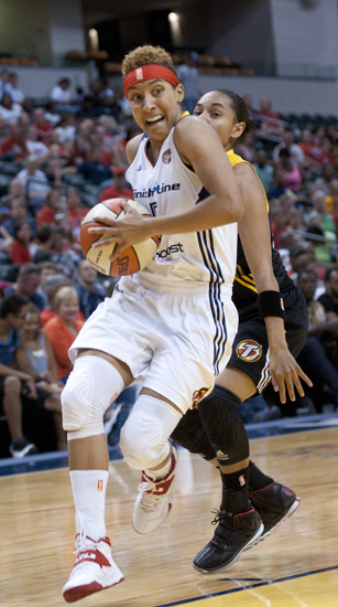 Fever guard Layshia Clarendon drives toward the basket during the Indiana Fever\'s 107-102 overtime loss to the Tulsa Shock at Bankers Life Fieldhouse, Wednesday, June 25, 2014.