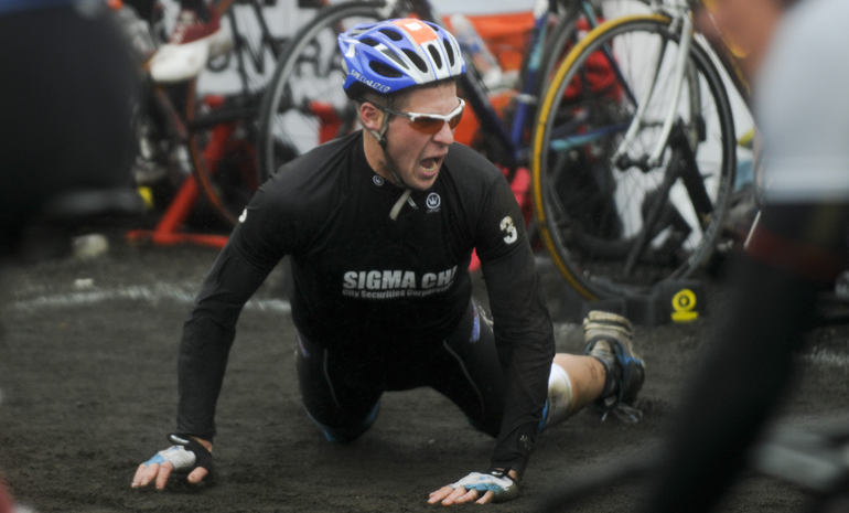 Sigma Chi junior Drew Morrow yells after cramping up during a bike exchange.