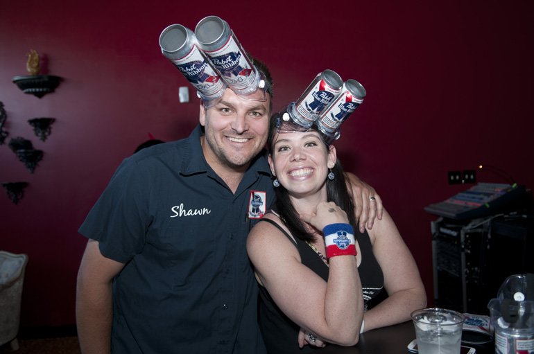 Shawn and Alayna Pabst wear Pabst Blue Ribbon beer goggles as they wait for the start of the first Rock Paper Scissors Indy City Championship at the White Rabbit in Fountain Square, Saturday, May 31, 2014. Teams of three filled a bracket of 32 teams and battled for a top prize of $500.
