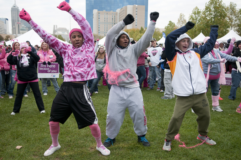Xavier Lee, Malcolm King and Gavin McLure dance zumba to keep warm before the Making Strides Against Breast Cancer 5K walk downtown, Saturday, Oct. 26, 2013.