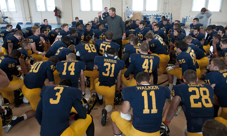 Franklin College football coach Mike Leonard talks to his team before their game against Anderson University in Franklin, Saturday, Oct. 19, 2013. Franklin\'s \