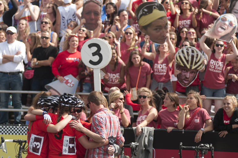 Kappa Alpha Theta riders huddle as their supporters cheer before the women\'s Little 500 at Bill Armstrong Stadium in Bloomington, Friday, April 25, 2014.