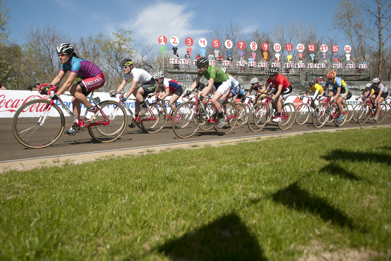 Riders speed through turn two during the women\'s Little 500 at Bill Armstrong Stadium in Bloomington, Friday, April 25, 2014.