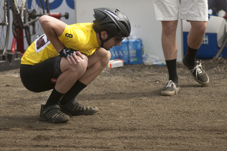 Beta Theta Pi rider Chris Craig stretches before a rider exchange during the men\'s Little 500 at Bill Armstrong Stadium in Bloomington, Saturday, April 26, 2014.