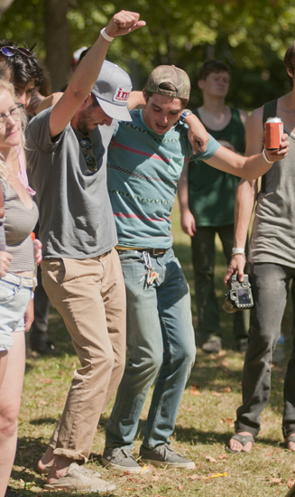 Luke Land and Mitchell Hemmelgarn dance while Today\'s Hits performs at the Cataracts Music Festival in Garfield Park, Saturday, August 24, 2013.