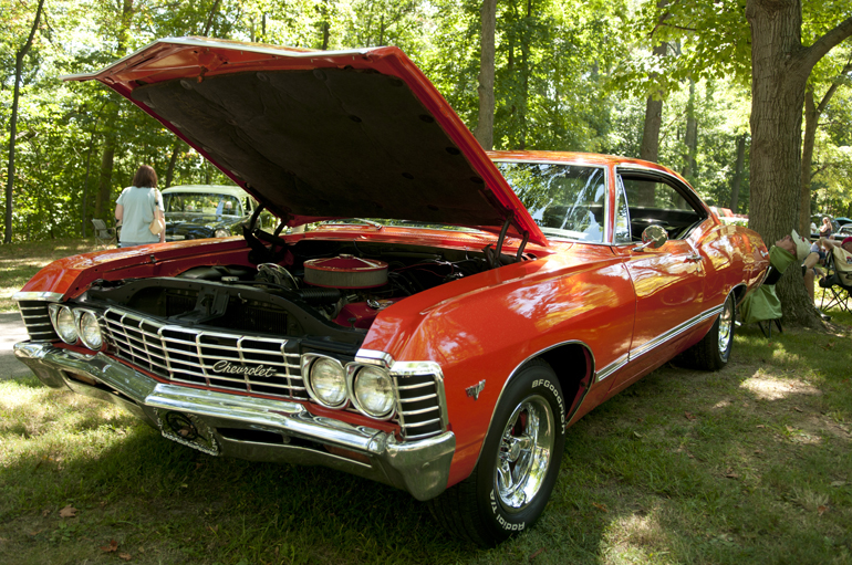 A 1967 Chevy Impala stands on display during the Lucky Teter Rebel Run Car Show in Noblesville, Saturday, August 24, 2013.