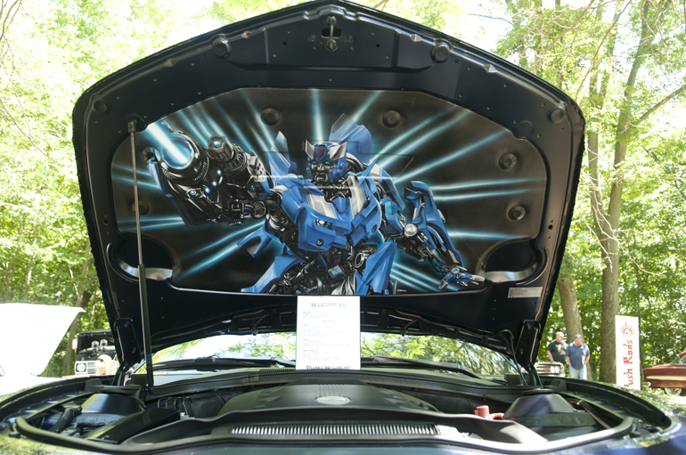 A 2010 Chevy Camaro LS with airbrushed Transformer Bluestreak stands on display during the Lucky Teter Rebel Run Car Show in Noblesville, Saturday, August 24, 2013.