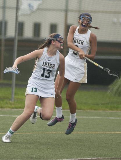 Cathedral junior Kate Flynn and senior Katherine Deighan celebrate a goal scored in the first minute of the final game of the Indiana Girl\'s Lacrosse Association State Tournament at Heritage Christian School in Indianapolis, Saturday, May 30, 2015.