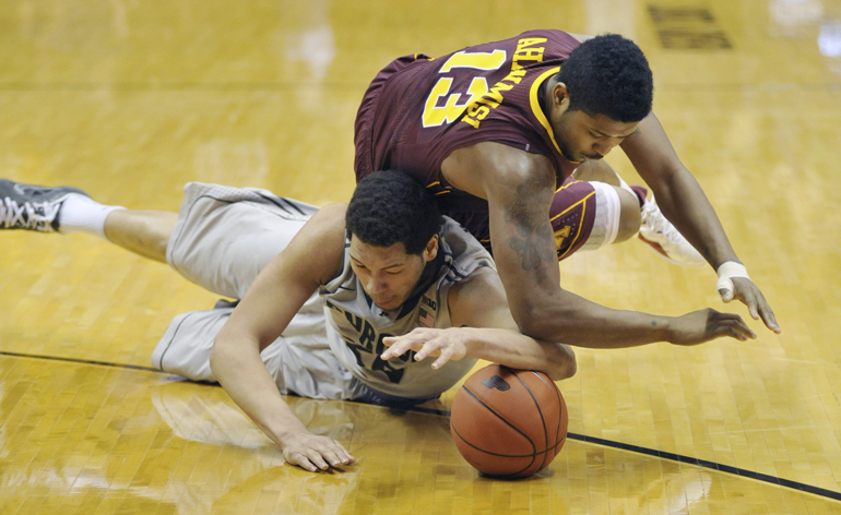 Purdue center A.J. Hammons fights for a loose ball with Minnesota guard Maverick Ahanmisi during an 89-73 victory over the Golden Gophers on Senior Day, Sat., March 9, 2013, at Mackey Arena in West Lafayette.