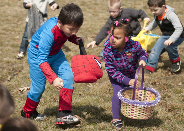 Elyel Mejia, 7 (Spider-Man), and DeStinee Oden-Chandler, 4, grab Easter eggs during the third annual Ivy Tech Dental Assisting Easter Egg Hunt & Sidewalk Carnival on Saturday, March 30, 2013, at Ivy Tech in Lafayette. The event raised money for the Judy Buckles Scholarship.