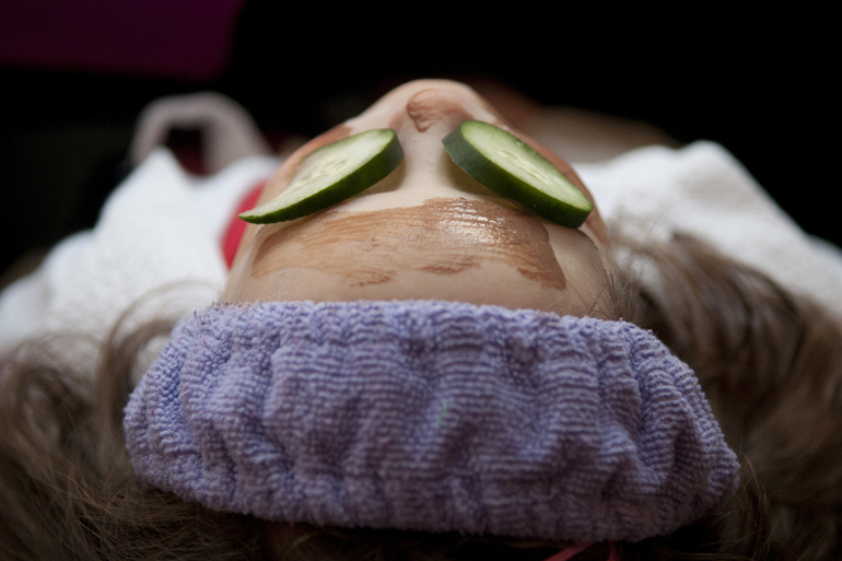 Rosie Lockwood relaxes under a face mask and cucumbers during her friend Kate Hollingsworth\'s birthday party and spa treatment provided by Pretty and Posh Parties in Fishers, Sunday, Feb. 15, 2015.
