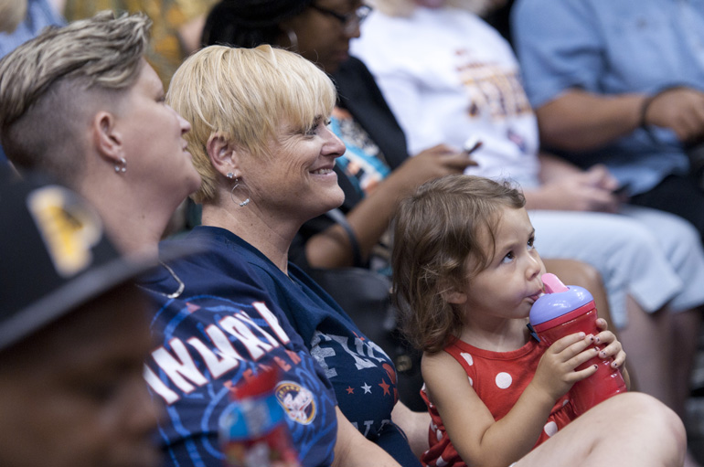 Lisa Satterly and Pam Dillon enjoy halftime entertainment with granddaughter Liliana Warden during the Indiana Fever\'s 107-102 overtime loss to the Tulsa Shock at Bankers Life Fieldhouse, Wednesday, June 25, 2014. Satterly and Dillon plan to get married by Monday to take advantage of a federal judge\'s ruling that Indiana\'s ban against same-sex marriage is unconstitutional.