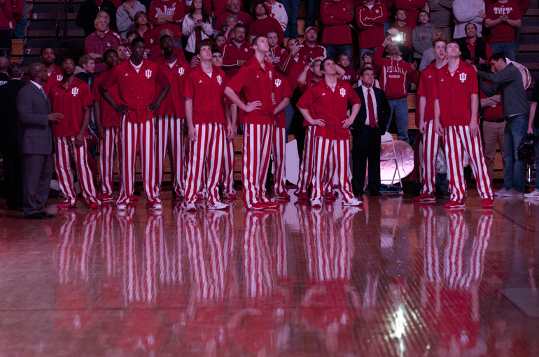 Hoosier players watch the pre-game highlight reel before their game against the University of North Florida at Assembly Hall in Bloomington, Saturday, Dec. 7, 2013.