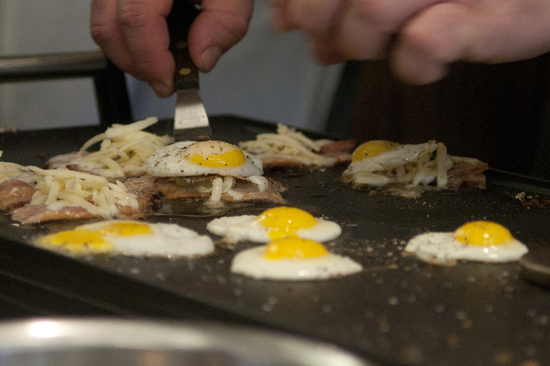 Roger Hawkins of Circle City Soups prepares a fried quail egg BLT, which won the Taste of the NFL Sandwich Cook-off at Recess on North College Avenue, Sunday, Jan. 4, 2015. Proceeds from the second annual cooking competition benefited Gleaners Food Bank.
