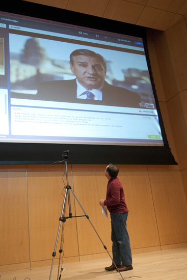 Paul Baltzell, chief information officer for the State of Indiana, watches a video from Todd Kimbriel, interim CIO for the State of Texas, during the launch of the #hackINvTX Challenge at the IUPUI Information and Communications Technology Complex, Saturday, Jan. 31, 2015. Kimbriel bragged for his state, pointing out that the first word said from the moon was, \