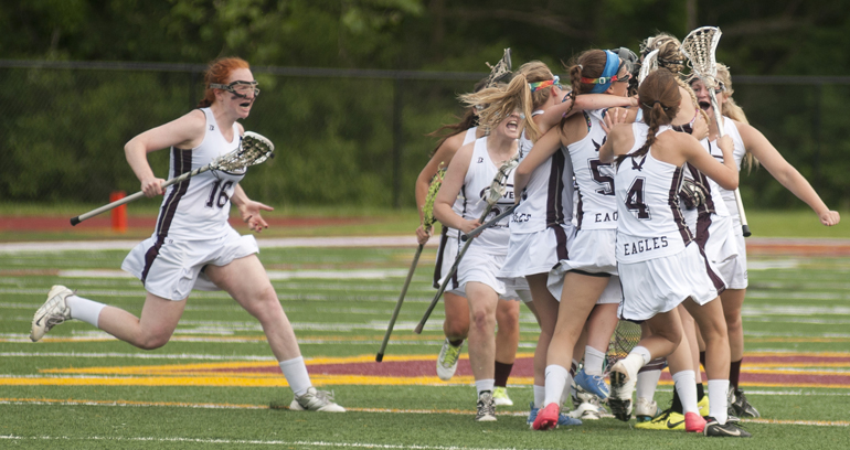 Culver Academy players run toward midfield to celebrate their 9-8 victory over Carmel in the Indiana Girls Lacrosse Association state championship at Brebeuf Jesuit Preparatory School in Indianapolis, Saturday, June 1, 2013.