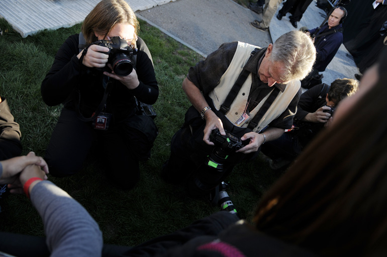 The campaign press pool, also known as "those who have stronger press credentials than mine," could take photos of Lucas' Sesame Street book from the other side of the fence as he held it there during the speech.
