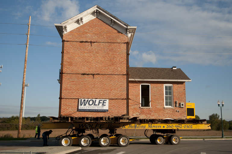 The 153-year-old Kincaid house is moved from its original location at 106th Street and Kincaid Drive half a mile north to the campus of Sallie Mae spinoff Navient, Saturday, Oct. 4, 2014. The house, originally scheduled for demolition, was saved by Indiana Landmarks and a social media campaign using the hashtag #thatfishershouse.