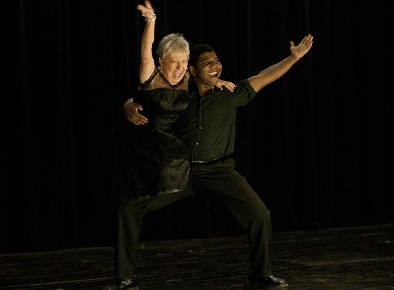 Rosalie Hyde, craft teacher at the Franklin Active Adult Center, and Arthur Murray Studio dancer Kyle Massenburg compete in the Dancing with the Johnson County Stars charity fundraiser at the Historic Artcraft Theatre in Franklin, Friday, Sept. 26, 2014. Hyde danced for donations for Johnson County Senior Services.