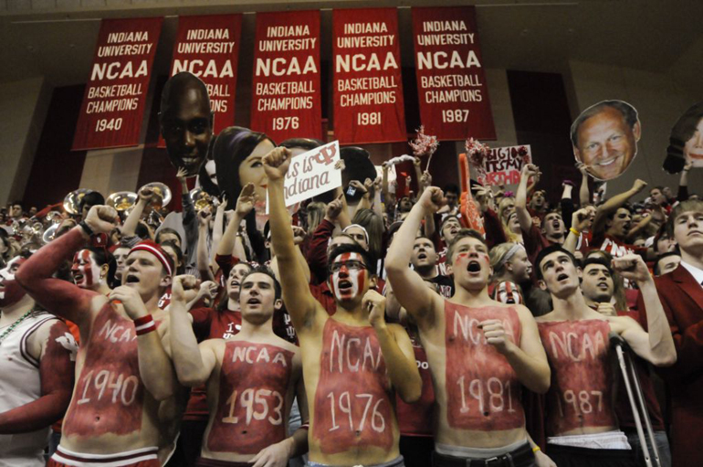 Indiana University basketball fans cheer in front of the school