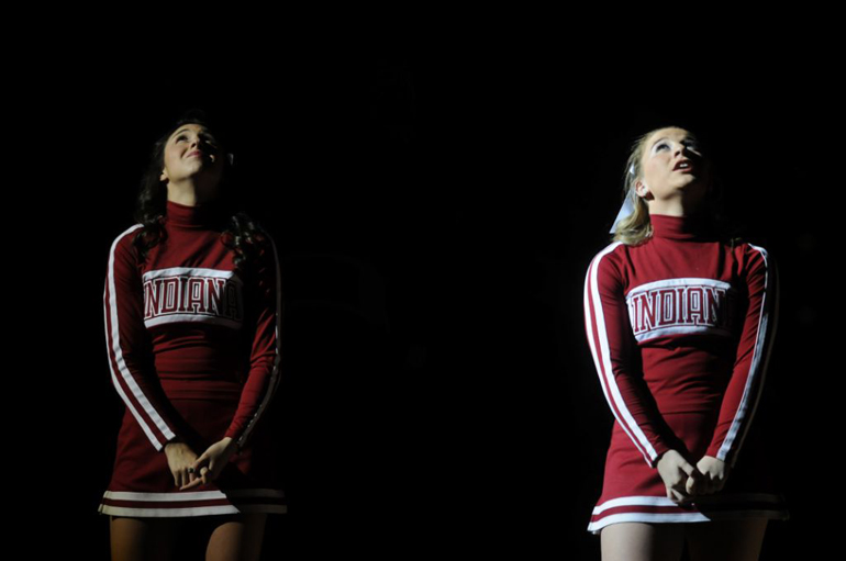 Indiana University sophomore cheerleaders Brittany Haas and Molly Stewart look up to the midcourt display before player introductions for IU
