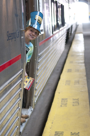 Paul Biermann, 5, looks out of an Amtrak sleeping car on display during National Train Day celebrations at Union Station, Saturday, May 10, 2014.