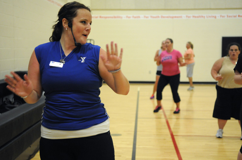 Zumba instructor Suzi Brown leads an exercise class at the Hendricks Regional Health YMCA in Avon, Monday, Aug. 13, 2012.
