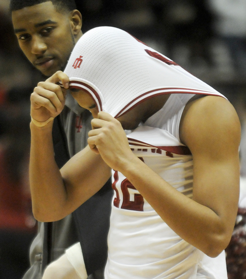 Indiana University forward Christian Watford looks at IU guard Verdell Jones as Jones hides his head under his jersey at the end of IU